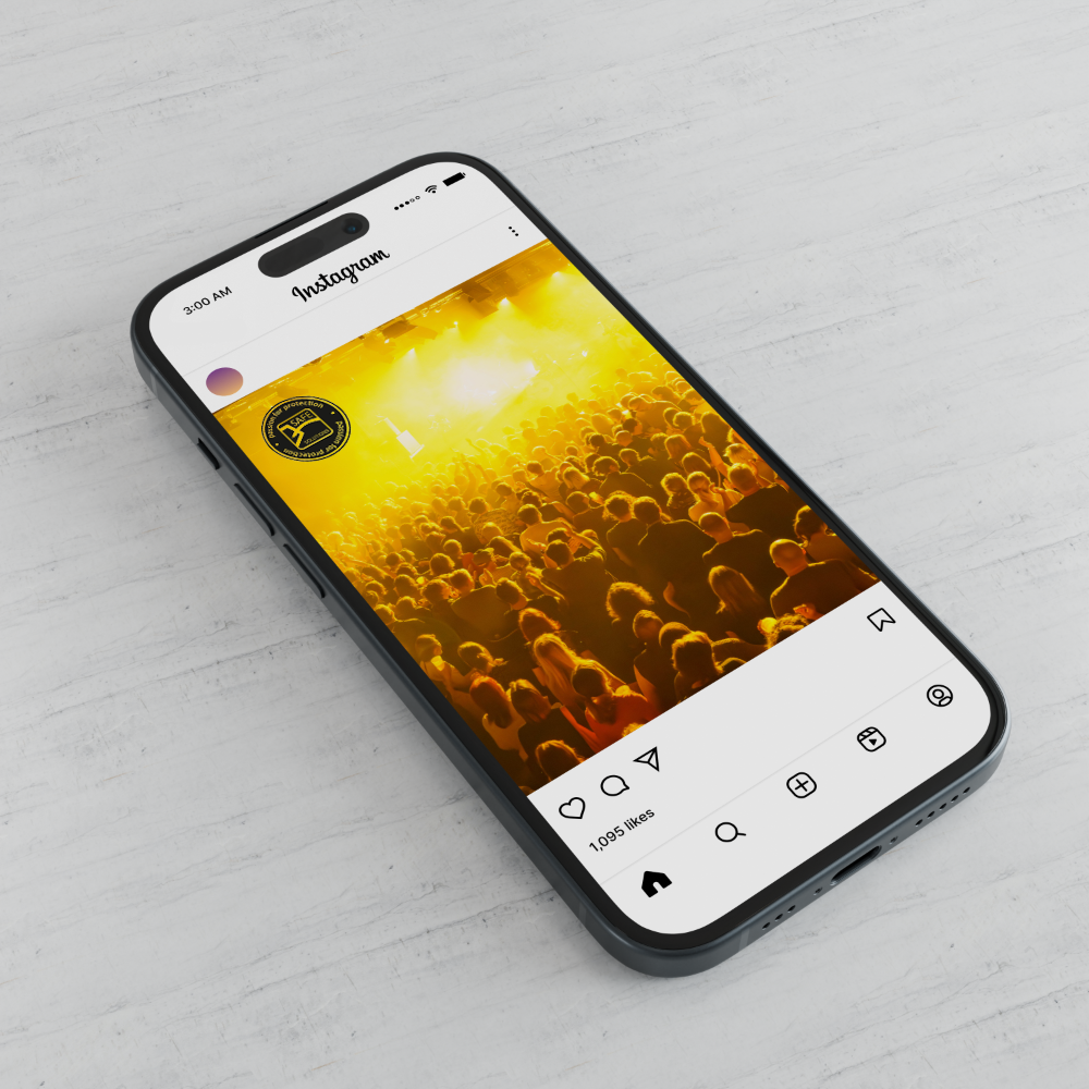 Smartphone showing a Safe Solutions Instagram post of a concert crowd